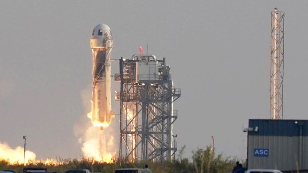 Blue Origin's New Shepard rocket launches carrying passengers Jeff Bezos, founder of Amazon and space tourism company Blue Origin, his brother Mark Bezos, Oliver Daemen and Wally Funk, from its spaceport near Van Horn, Texas, Tuesday, July 20, 2021. (AP Photo/Tony Gutierrez)
