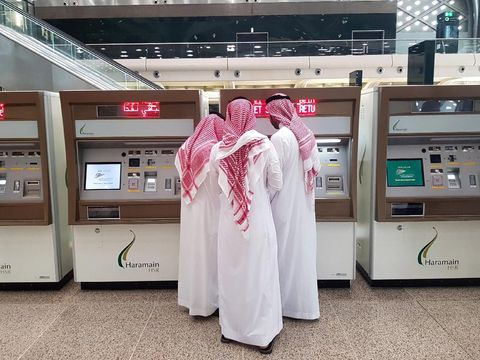 Saudi people buy tickets for the new Haramain speed train at King Abdullah Economic City, near Jeddah, Saudi Arabia September 18, 2018. Picture taken September 18, 2018. REUTERS/Stephen Kalin